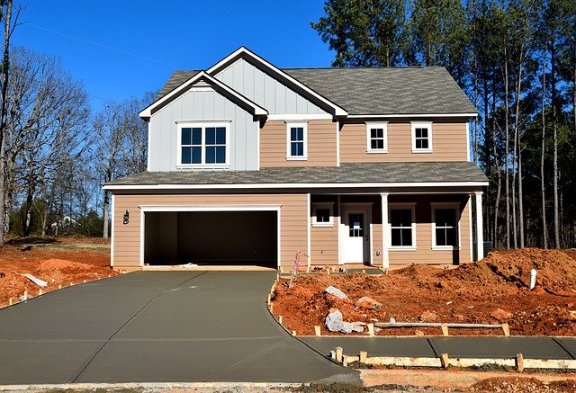 Freshly poured concrete driveway at a new home
